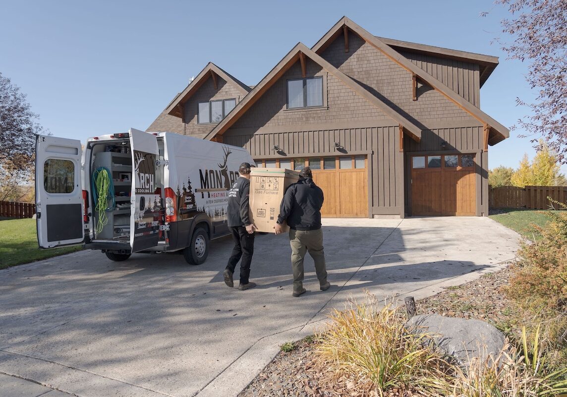 Carrying gas furnace monarch Monarch employees carrying a gas furnace into customers home