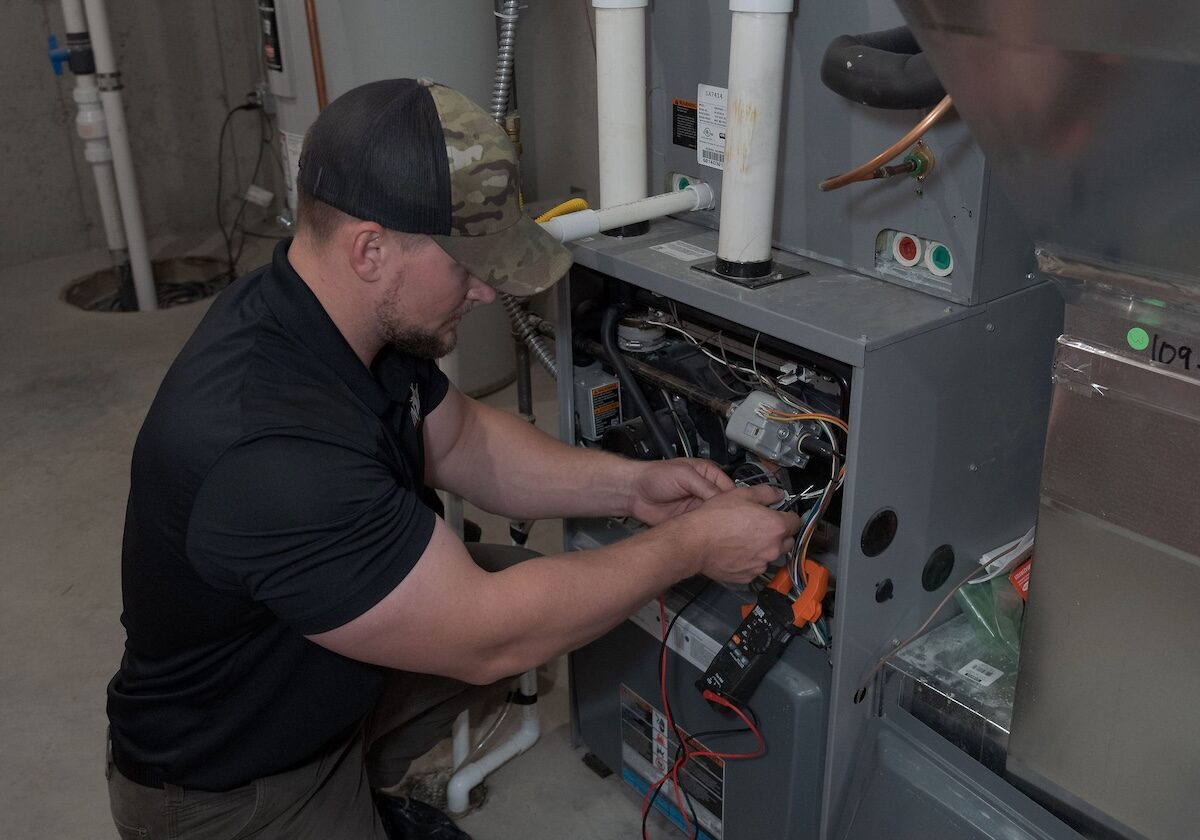 Furnace maintenance and installation Gas furnace installation being completed by a monarch employee