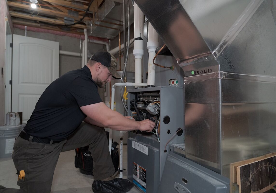 furnace installation wiring Monarch technician working on furnace installation
