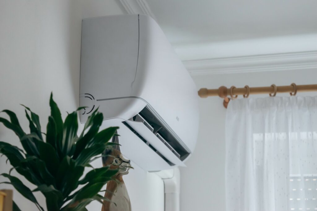Ductless Air conditioner installed of wall of family home