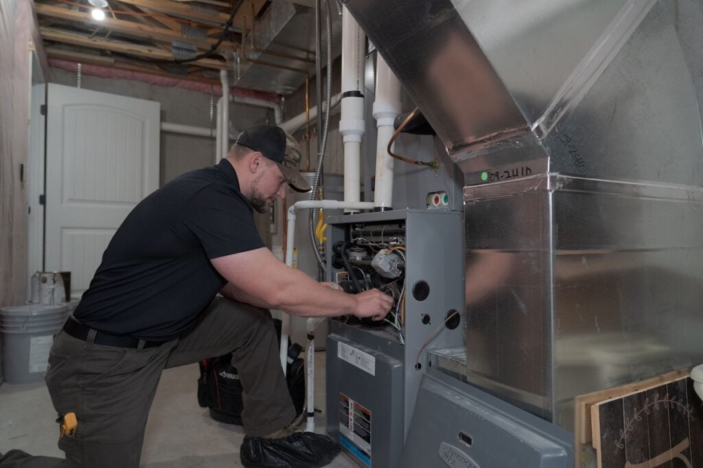 Monarch technician working on furnace installation