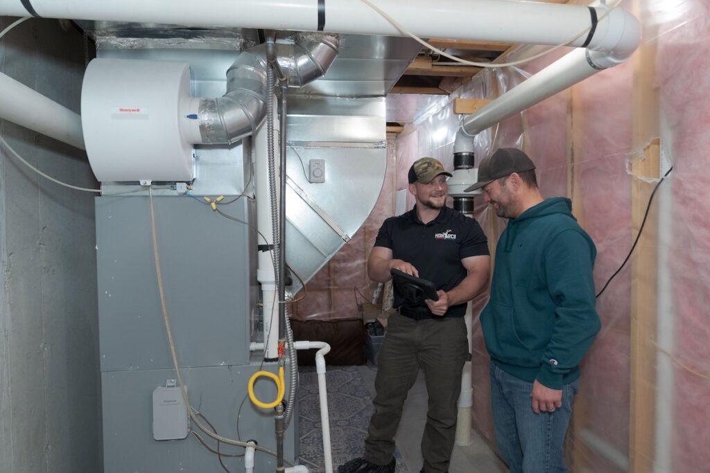 Monarch tech talking to customer about their new furnace