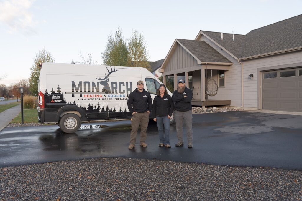 Monarch team outside standing in front of company van