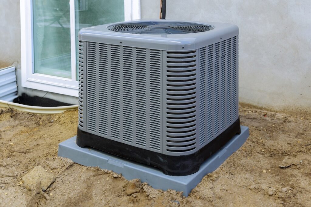 Air conditioning system unit installed outside facade of the house